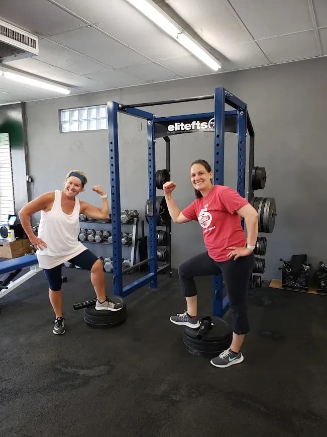 Members building strength at the power rack